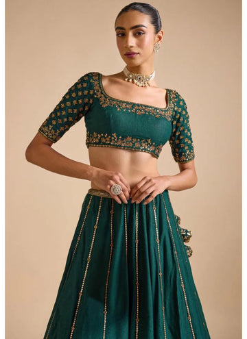 Charming Green Mehendi event Lehenga choli with elegant zari and sequin work